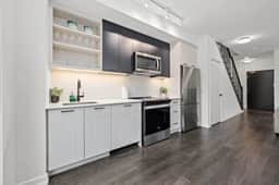 Spacious 2BR Townhouse w/ Parking & Workspace - Image 3