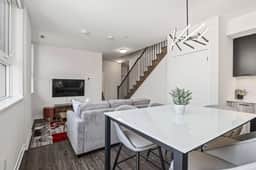 Sleek 2BR Den Townhouse | Parking & Views - Image 4