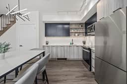 Sleek 2BR Den Townhouse | Parking & Views - Image 3