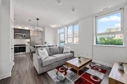 Sleek 2BR Den Townhouse | Parking & Views - Image 2