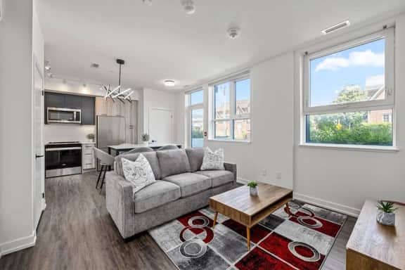 Sleek 2BR Den Townhouse | Parking & Views - Image 2